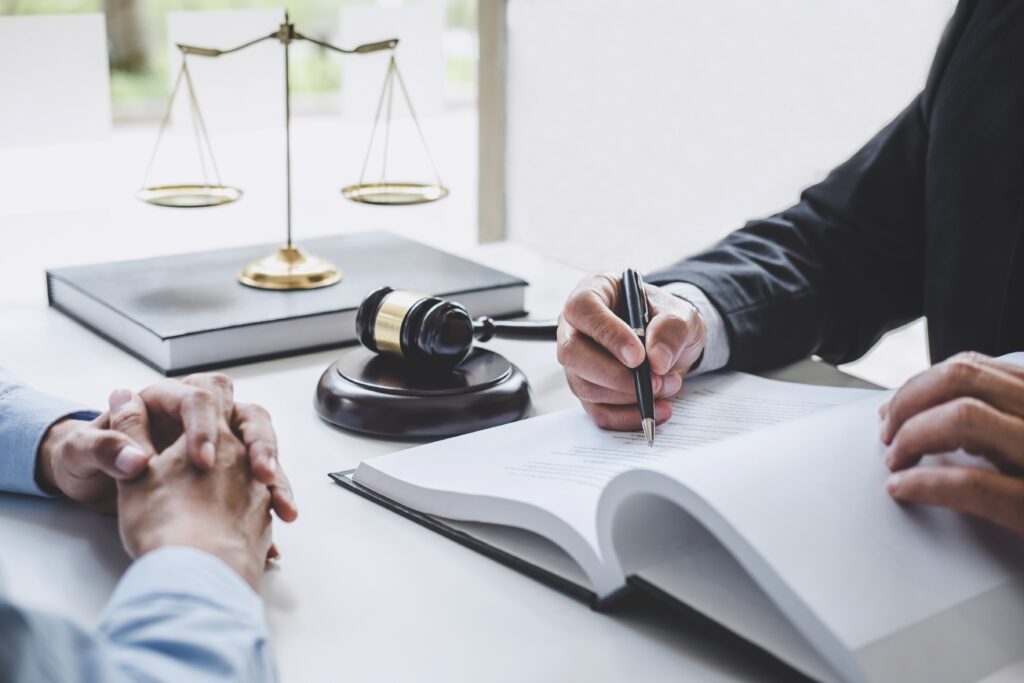 Legal consultation with gavel and scales.