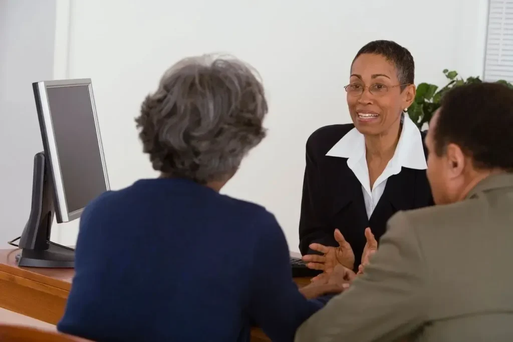 A landlord attorney discusses legal options with clients.